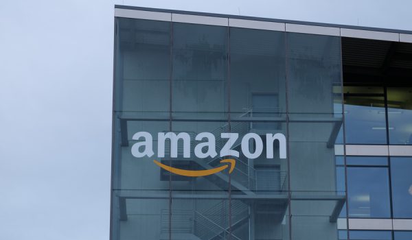 Munich, Bavaria Germany - February 3 2021: Amazon Deutschland Services GmbH e-commerce german headquarters office building with wet glass green trademark logo.