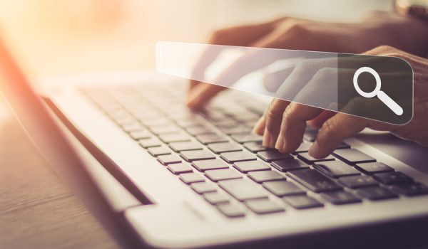 Businesswoman using laptop searching Browsing Internet Data Information