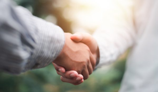 Businessmen shaking hands to indicate a business deal,successful contract management of the company,signing an agreement,business partner,New opportunities for the future of the industry,joint venture