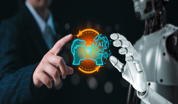 Human and robot hand as a symbol of connection between people and AI technology with chatbot communicate.Robot application, conversation assistant, Futuristic technology transformation.