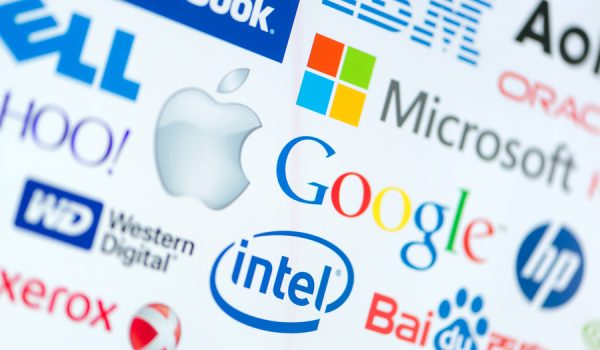 Kiev, Ukraine - June 12, 2014: A logotype collection of well-known world top companies of computer technologies on a monitor screen. Include Google, Apple, Microsoft, Intel and other logos.