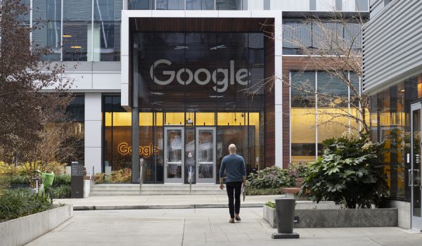 Seattle, WA, USA - Dec 21, 2023: A Googler walks back to Google's South Lake Union office in Seattle, Washington.