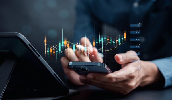 Businessmen investor think before buying stock market investment using smartphone to analyze trading data. investor analysis with stock exchange graph on screen. Financial stock market. Businessmen investor think before buying stock market investment using smartphone to analyze trading data. investor analysis with stock exchange graph on screen. Financial stock market.