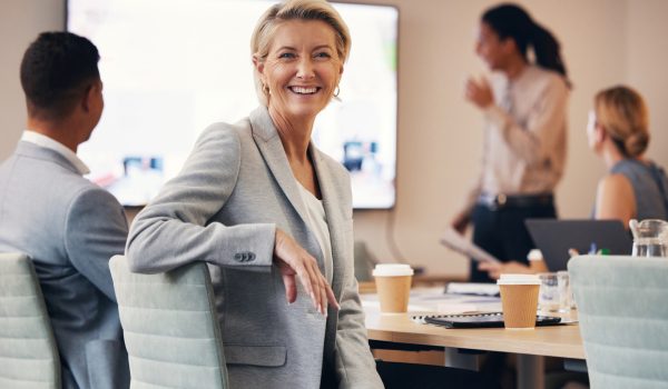 Business woman, portrait or leadership in office boardroom meeting, marketing workshop or advertising training goal. Smile, happy or mature corporate ceo in teamwork collaboration or diversity review