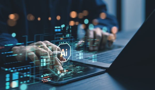 Humans are using laptops and computers to interact with AI, helping them create, code, train AI, or analyze big data with fast, cutting-edge  technology.