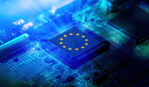 EU flag on a CPU processor. European chip manufacturer concept, GPU microchip on a motherboard.