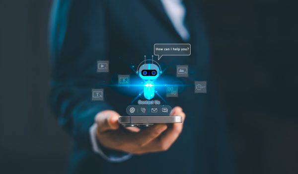 Business professional holding smartphone with AI chatbot contact us hologram icon, futuristic digital customer support, virtual assistant technology, online communication service concept. contact us