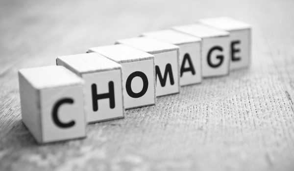concept word forming with cube on wooden desk background - Chomage (unemployment in french)